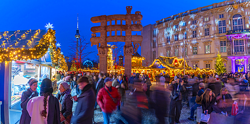 View of Christmas market stalls in Vorplatz Berliner Schloss at Christmas and Berlin TV Tower in background, Mitte, Berlin, Germany, Europe