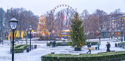 View of Christmas market and ferris wheel during winter at dusk, Stortingsparken, Oslo, Norway, Scandinavia, Europe