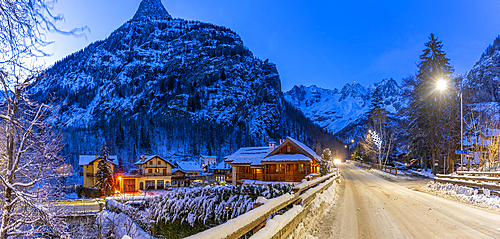 View of chalets and snow covered mountains in Courmayeur at dusk during winter, Courmayeur, Aosta Valley, Italy, Europe