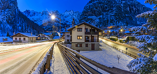 View of chalets and snow covered mountains in Courmayeur at dusk during winter, Courmayeur, Aosta Valley, Italy, Europe