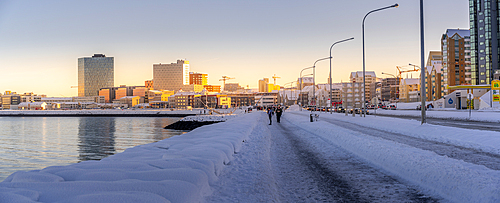 View of shore walk and the city of Reykjavík during winter, Reykjavík, Iceland, Europe