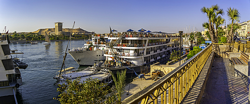View of cruiseboats on the Nile river from the promenade on a sunny day, Aswan, Nubia, Egypt, North Africa, Africa