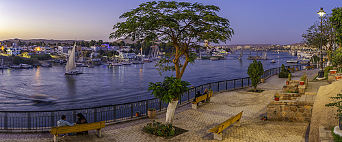 View of fellucas on the Nile river from Feryal Garden at dusk, Aswan, Nubia, Egypt, North Africa, Africa