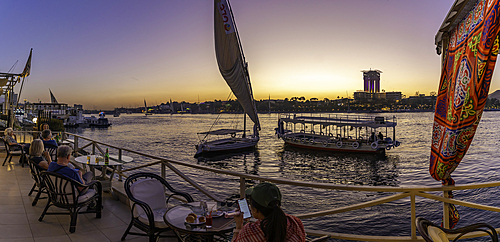 View of fellucas on the Nile river at dusk, Aswan, Nubia, Egypt, North Africa, Africa
