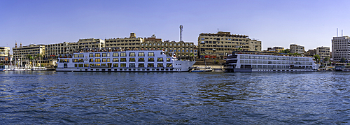 View of cruise boats on the Nile river from small boat in Aswan, Aswan, Nubia, Egypt, North Africa, Africa