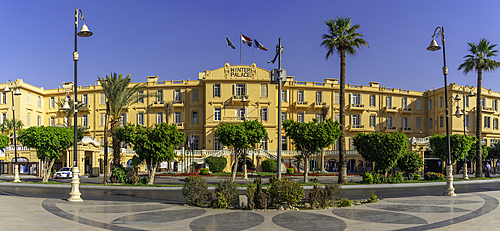 View of the Winter Palace Hotel on the corniche in Luxor on a sunny day, Luxor, Egypt, Africa