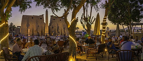 View of Luxor Temple and cafe at dusk, Luxor, Egypt, Africa
