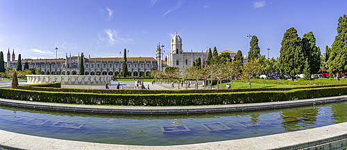 View of Jerónimos Monastery (Monastery of the Hieronymites) from Empire Square Garden on a sunny day, Lisbon, Portugal, Europe