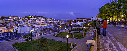 View of Lisbon from Miradouro de São Pedro de Alcântara at dusk, Lisbon, Portugal, Europe