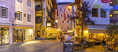 View of restaurants in Zell am See at dusk, Zell am See, Salzburg, Austria, Europe