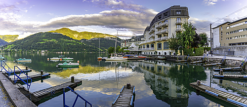 View of The Grand Hotel, mountains and Lake Zell during golden hour, Zell am See, Salzburg, Austria, Europe