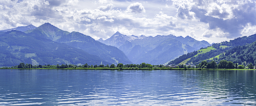 View of mountains and Lake Zell from cruise boat on a sunny day, Zell am See, Salzburg, Austria, Europe