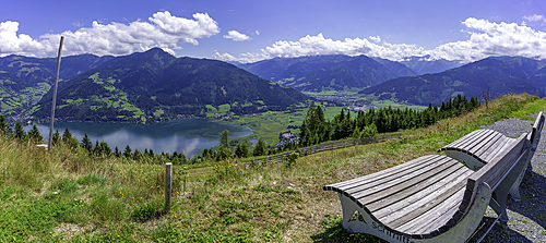 View of flowers, meadows and mountains from Plettsaukopf Reservoir on a sunny day, Bruckberg, Salzburg, Austria, Europe