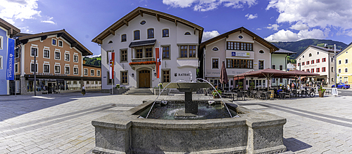 View of colourful buildings and Rathaus in Stadtplatz Mittersill on a sunny day, Salzburg, Austria, Europe