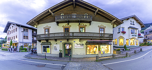 View of shops in Kaprun at dusk during summer, Kaprun, Zell am See, Salzburg, Austria, Europe
