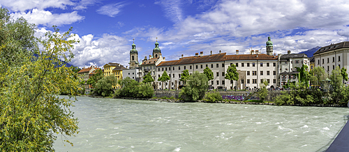 View of St. Jakob Cathedral, colourful buildings and River Inn on a sunny day in summer, Innsbruck, Tyrol Region, Austria, Europe