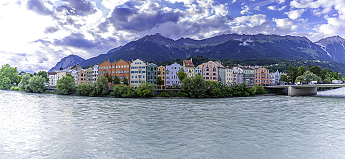 View of colourful buildings and River Inn at sunset in summer, Innsbruck, Tyrol Region, Austria, Europe