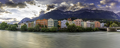 View of colourful buildings and River Inn at sunset in summer, Innsbruck, Tyrol Region, Austria, Europe