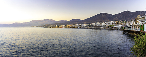 View of coastline and Paralia Limena Chersonisou Beach in Limenas Chersonisou during golden hour, Crete, Greek Islands, Greece, Europe