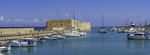 View of Koules Venetian Fortress and boats in Heraklion Venetian Port on a sunny day, City of Heraklion, Crete, Greek Islands, Geece, Europe