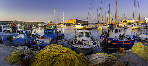 View of Koules Venetian Fortress and boats in Heraklion Venetian Port at sunset, City of Heraklion, Crete, Greek Islands, Geece, Europe