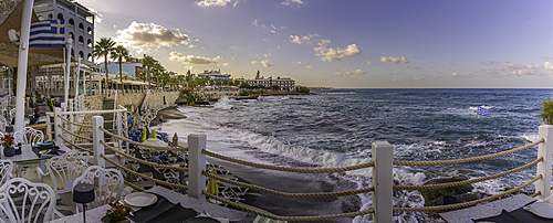 View of taverna overlooking the sea in Limenas Chersonisou at sunset, Crete, Greek Islands, Greece, Europe