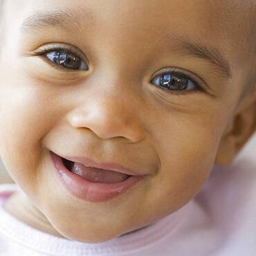 Close up of African American baby smiling