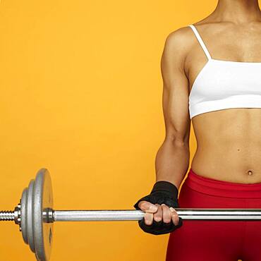 African woman lifting weights