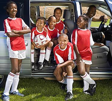 Multi-ethnic children in soccer uniforms