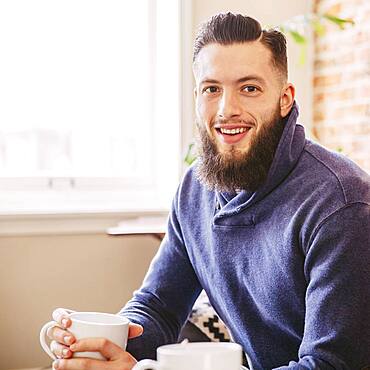 Caucasian man drinking coffee