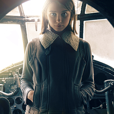 Caucasian woman standing in cockpit