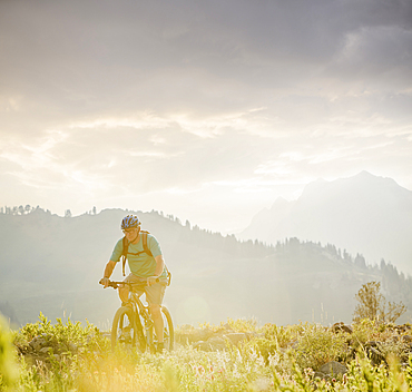 Caucasian man riding mountain bike