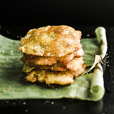 Tostones on banana leaf