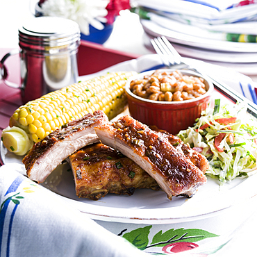 Pork rib dinner with corn and beans