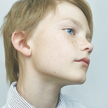 Close up of Caucasian boy with freckles