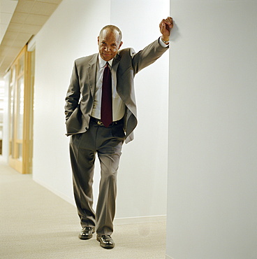 Businessman in office hallway