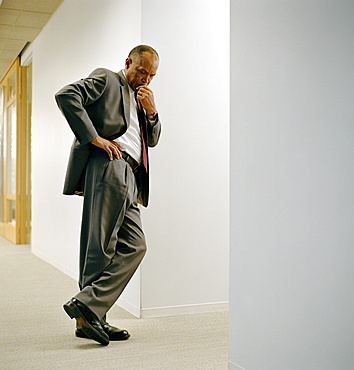 Businessman in office hallway