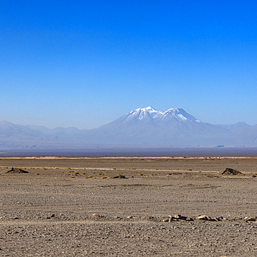 Distant volcano cone in Atacama Desert