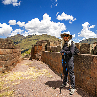 Portrait of smiling woman amid Incan ruins