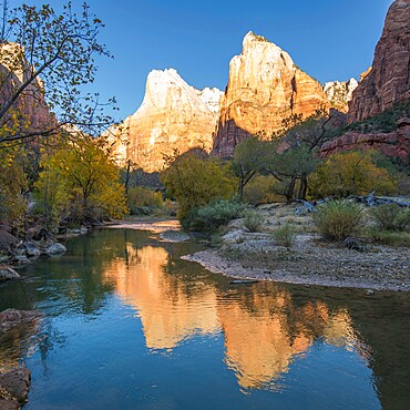 Abraham and Isaac Peaks reflected in the Virgin River at sunrise, autumn, Court of the Patriarchs, Zion National Park, Utah, United States of America, North America