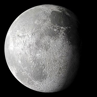 Waning gibbous moon in the night sky showing crater detail