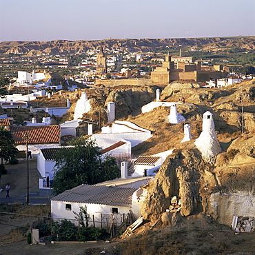 Cave dwellings and town from the suburb, Barrida des Cuevas, Guadix, Andalucia, Spain, Europe