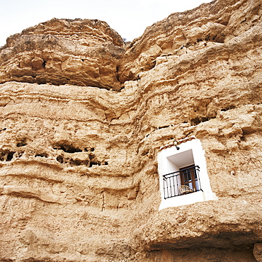 Bedroom window of cave accommodation, Belerda, near Guadix, Andalucia, Spain, Europe