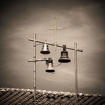 Bells and Crosses on the roof of a church, Haute-Loire department, Auvergne, France, Europe