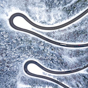 Winter snow road serpentine curves Lochenpass forest aerial photo way square curve, Germany, Europe