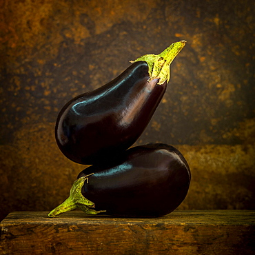 Eggplants on a brown background