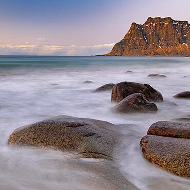 Winter coastal landscape with stormy sea, rocks, long exposure, Uttakleiv strand, Leknes, Nordland, Lofoten, Norway, Europe