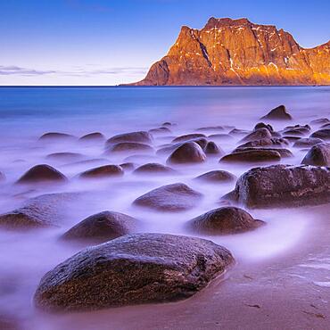 Winter Scandinavian landscape, long exposure, coast, beach, sea, mountains, snow, Uttakleiv strand, Leknes, Nordland, Lofoten, Norway, Europe