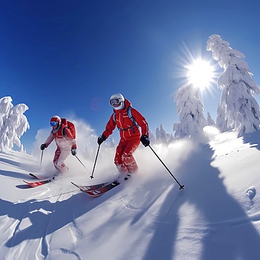 Skier skis fast down a slope on heavily snowy slope, blue sky and sunshine