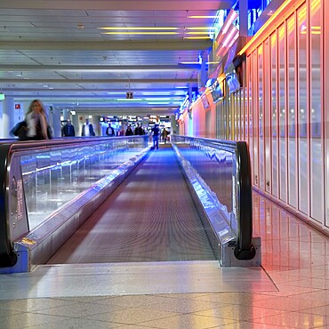 Blurred paople on airport walkway